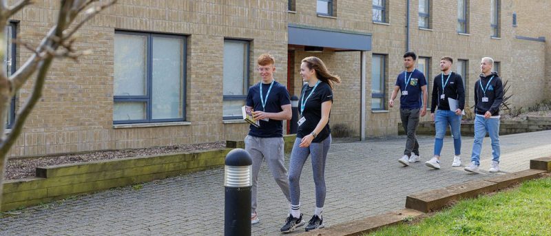 Students walking in front of accommodation