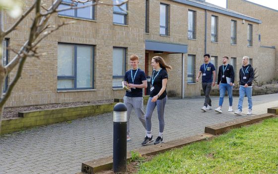 Students walking in front of accommodation