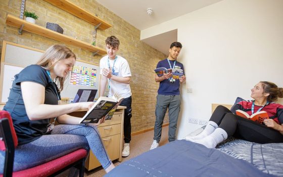 Students studying in accommodation room