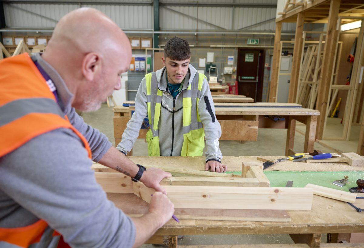 Student and lecturer discussing wood