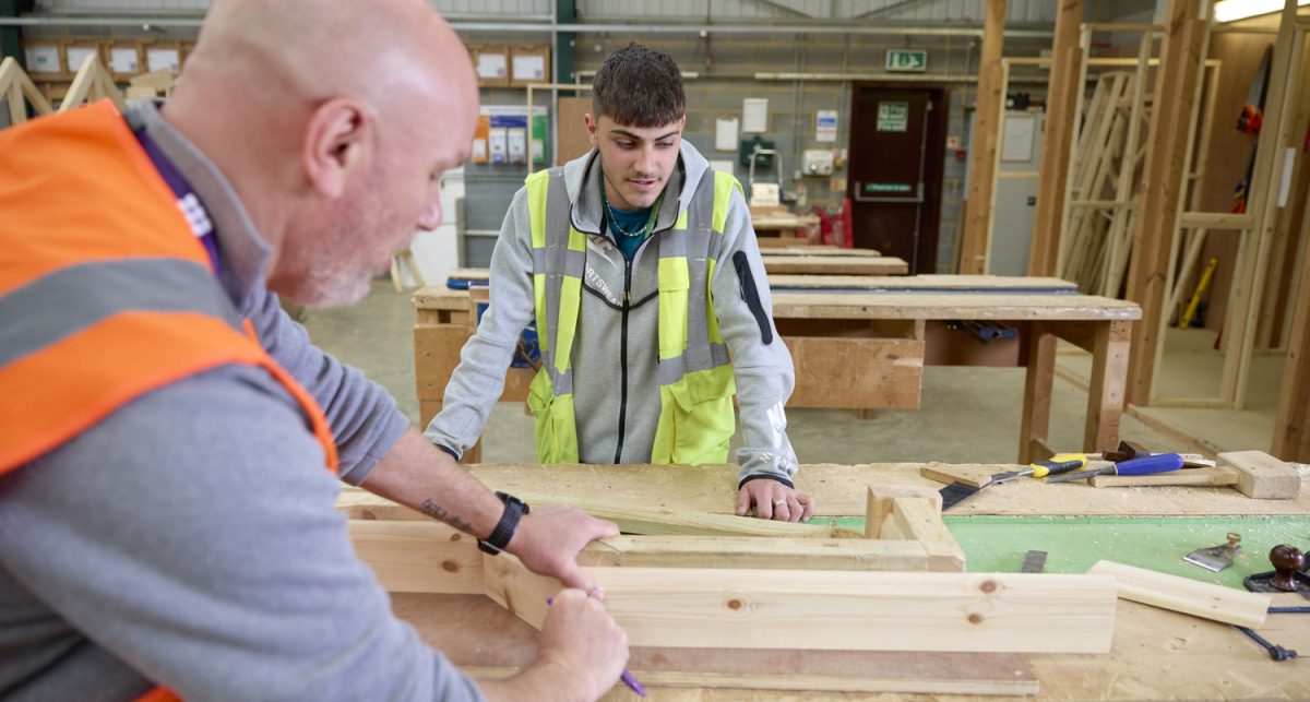 Student and lecturer discussing wood