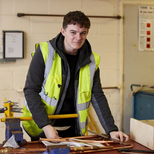 Student measuring pipe