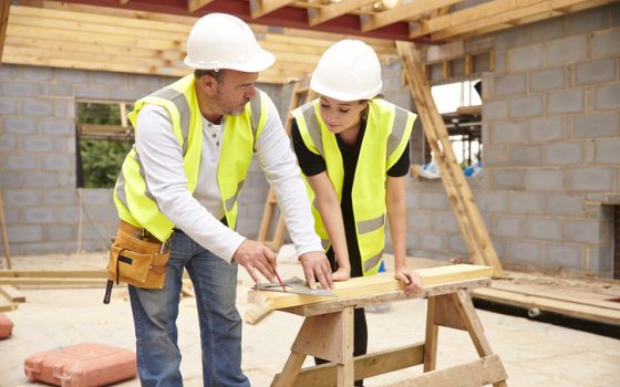 Female carpentry apprentice on site