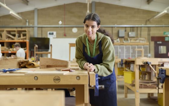 Furniture Studies Student using chisel on a piece of wood