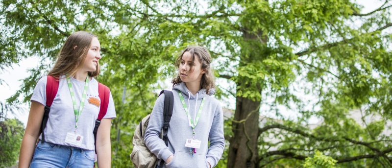 Students walking through arboretum