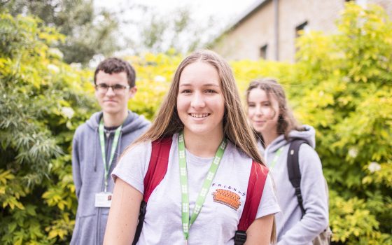 Students on campus looking at camera