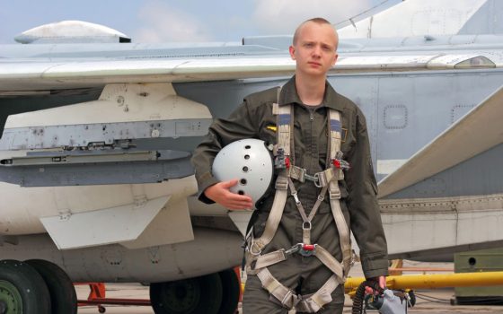 Man in front of plane