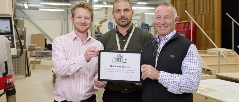 NBJ (London) Limited accepting their Skills Heroes award from Adam Palmer, Lecturer in Furniture Studies.