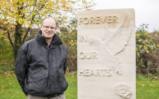 Stonemason Mark Mc Donnell with his sculpture