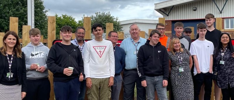 Students and staff celebrating the official unveling of the project