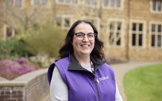 Careers Advisor smiling wearing a purple moulton vest