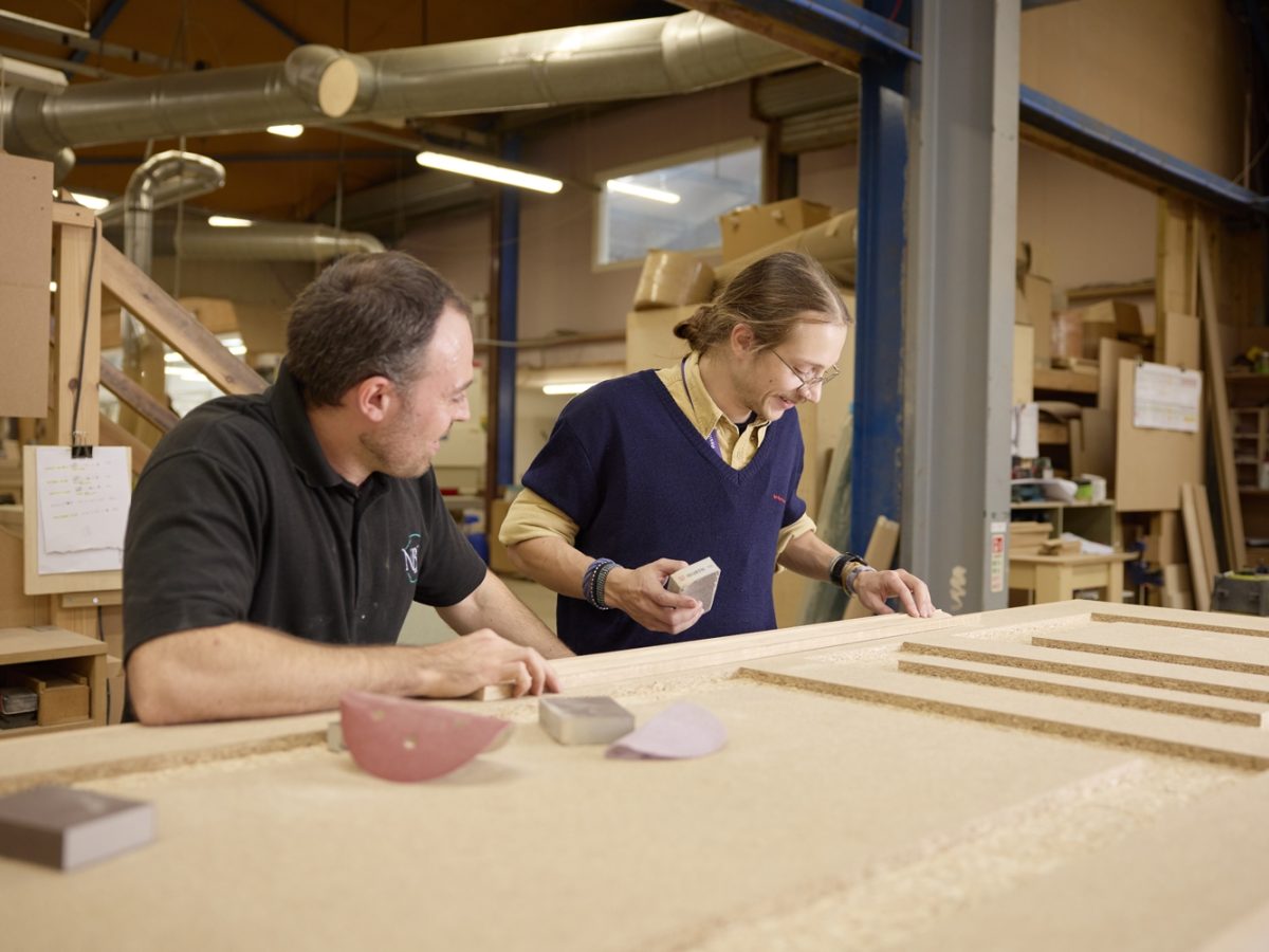 Furniture studies student with NBJ team in the workshop.